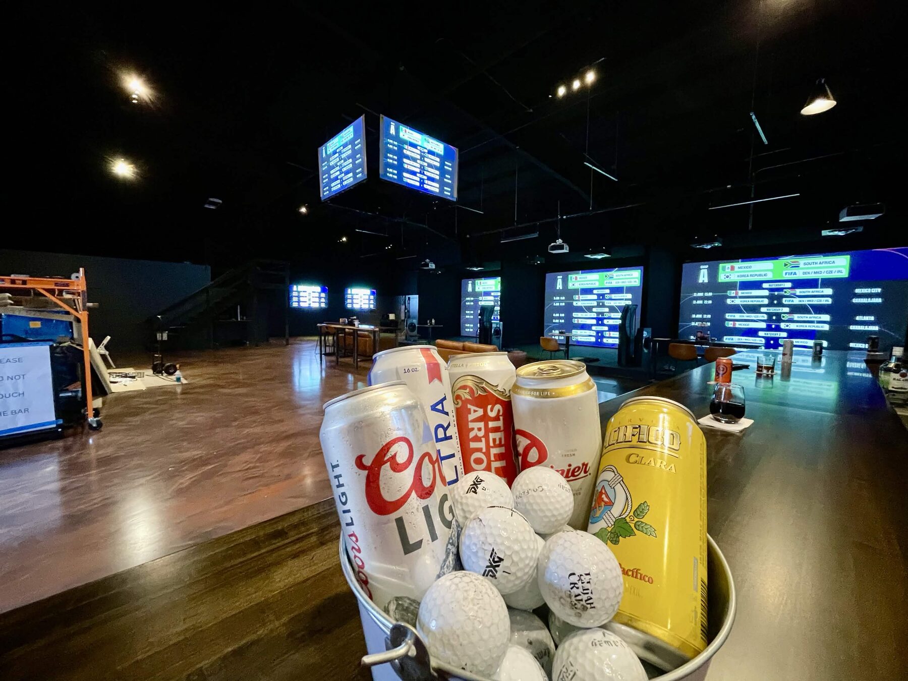 Pin Seeker Indoor Golf & Sports Grill venue with simulator bays and sports screens